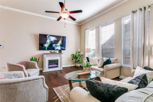 a living room with fireplace furniture and a flat screen tv