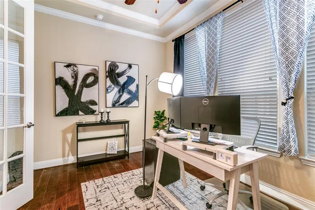 a workspace with furniture and wooden floor