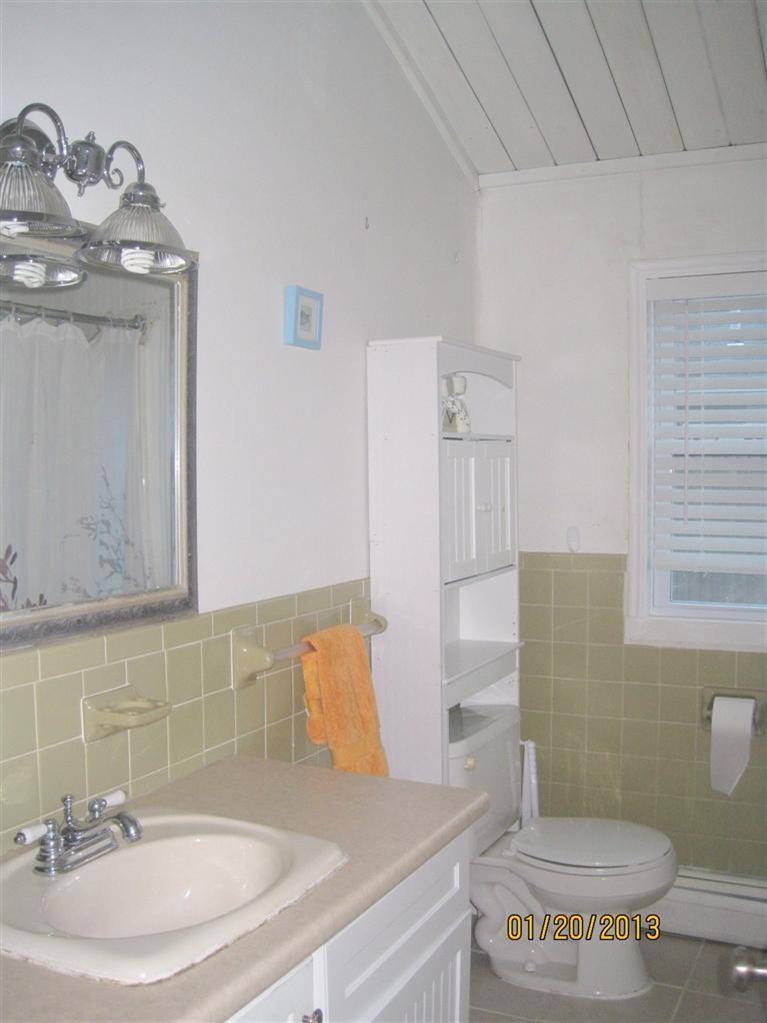 41 Lake Road Yarmouth, MA 02673 - Photo 9 of 22 a bathroom with a sink a toilet and mirror