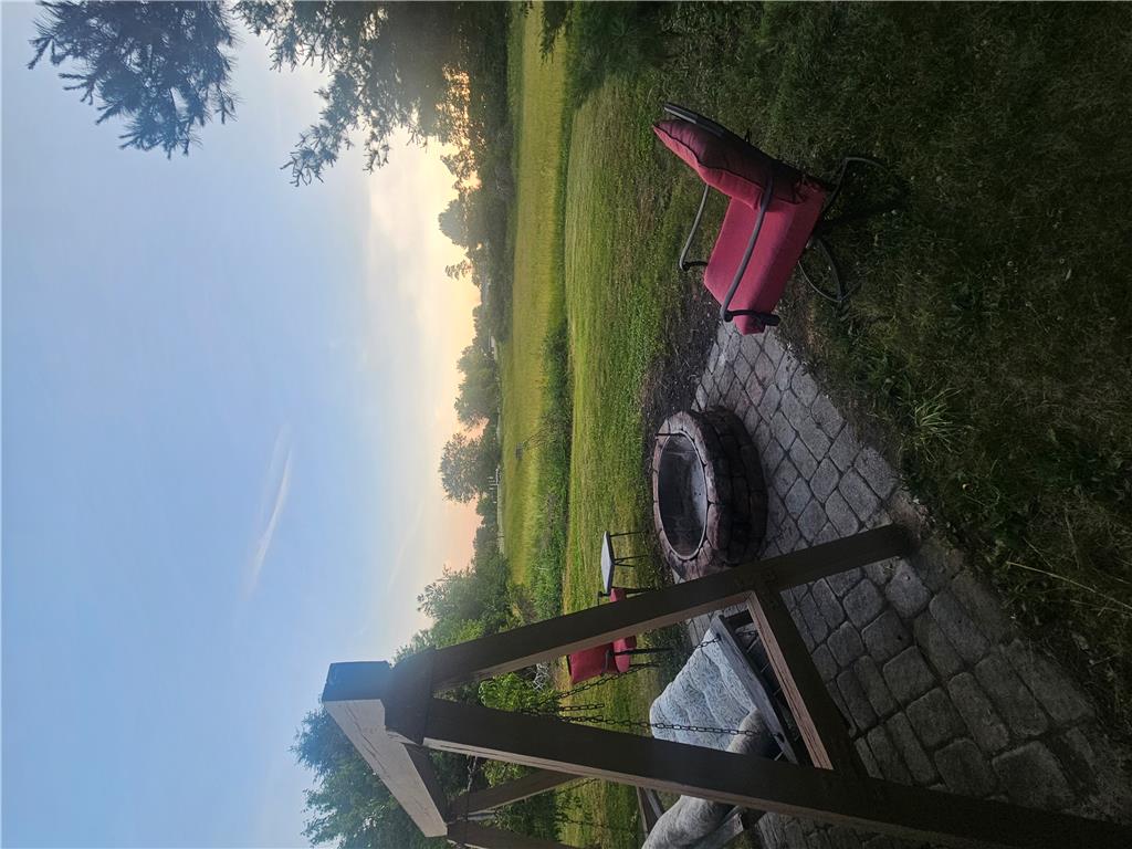 4065 Airport Road Allentown, PA 18109 - Photo 28 of 28 A quaint fire pit with surrounding pavers offers an inviting space for evening gatherings.