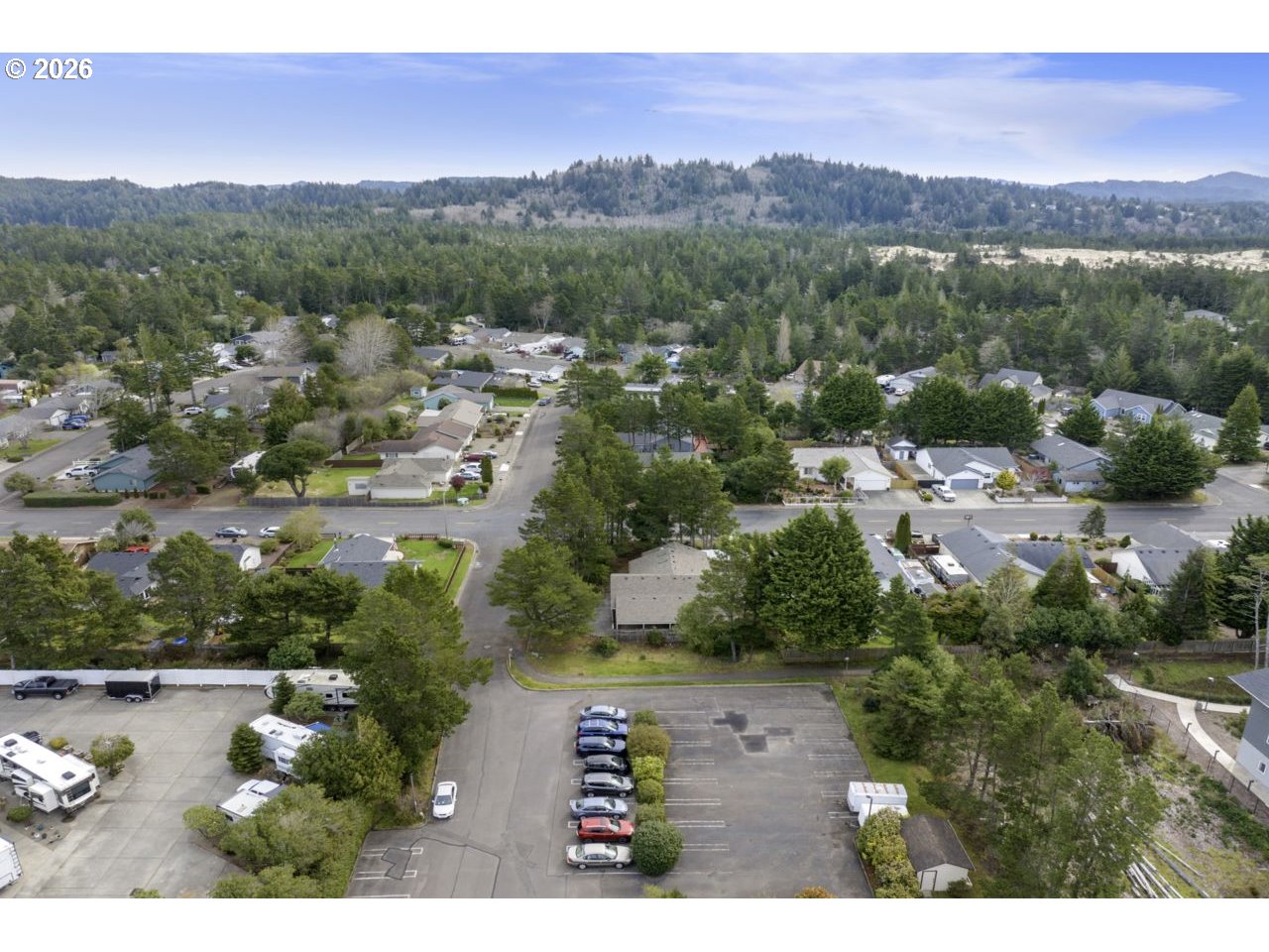 1960 40th Street Florence, OR 97439 - Photo 47 of 48 an aerial view of residential house with outdoor space and mountain view