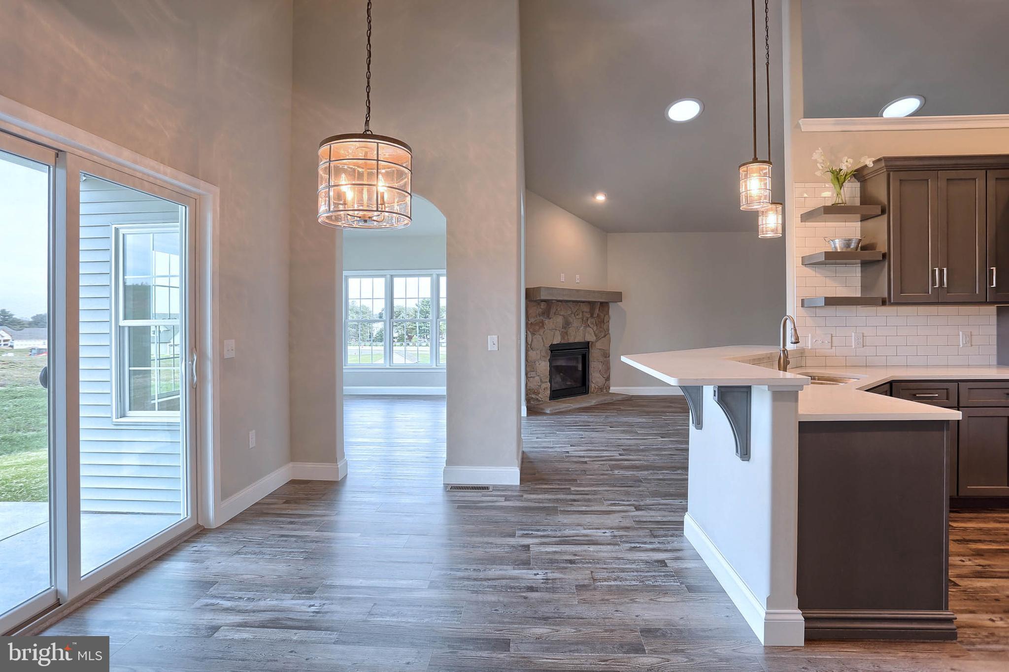 21 Rolling Meadow Road Lebanon, PA 17046 - Photo 13 of 37 an entryway with wooden floor and a living room