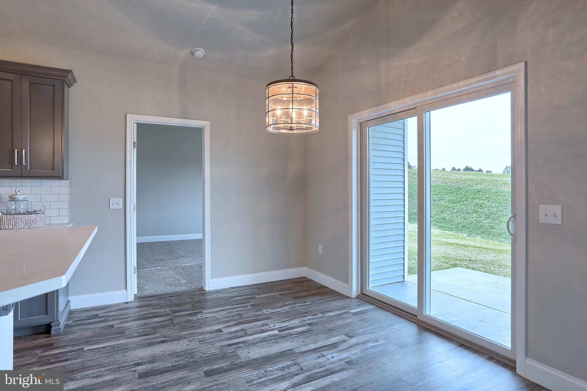 21 Rolling Meadow Road Lebanon, PA 17046 - Photo 14 of 37 a view of a room with wooden floor chandeliers and kitchen