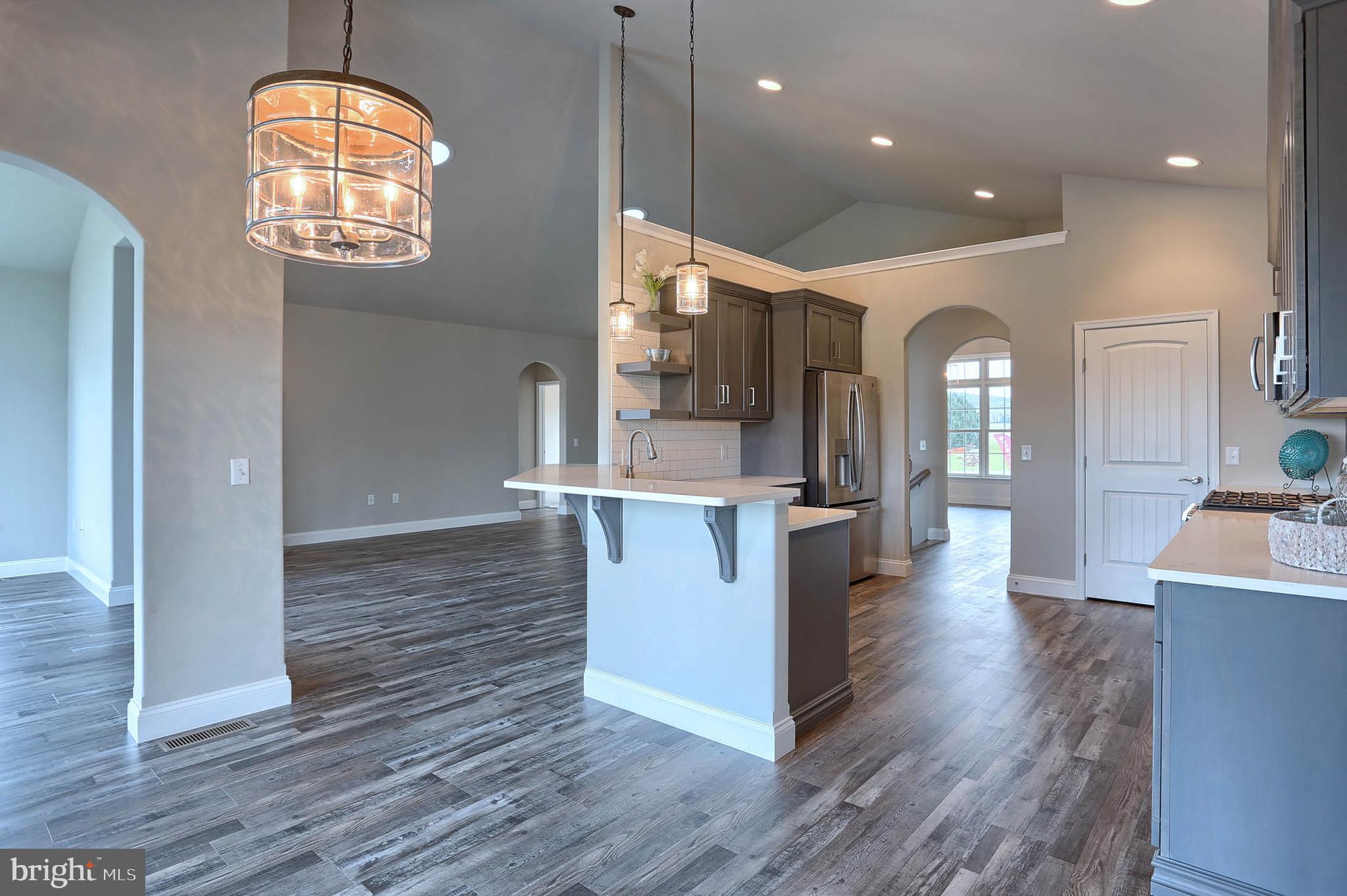 21 Rolling Meadow Road Lebanon, PA 17046 - Photo 16 of 37 an open kitchen with wooden floor and a view of living room