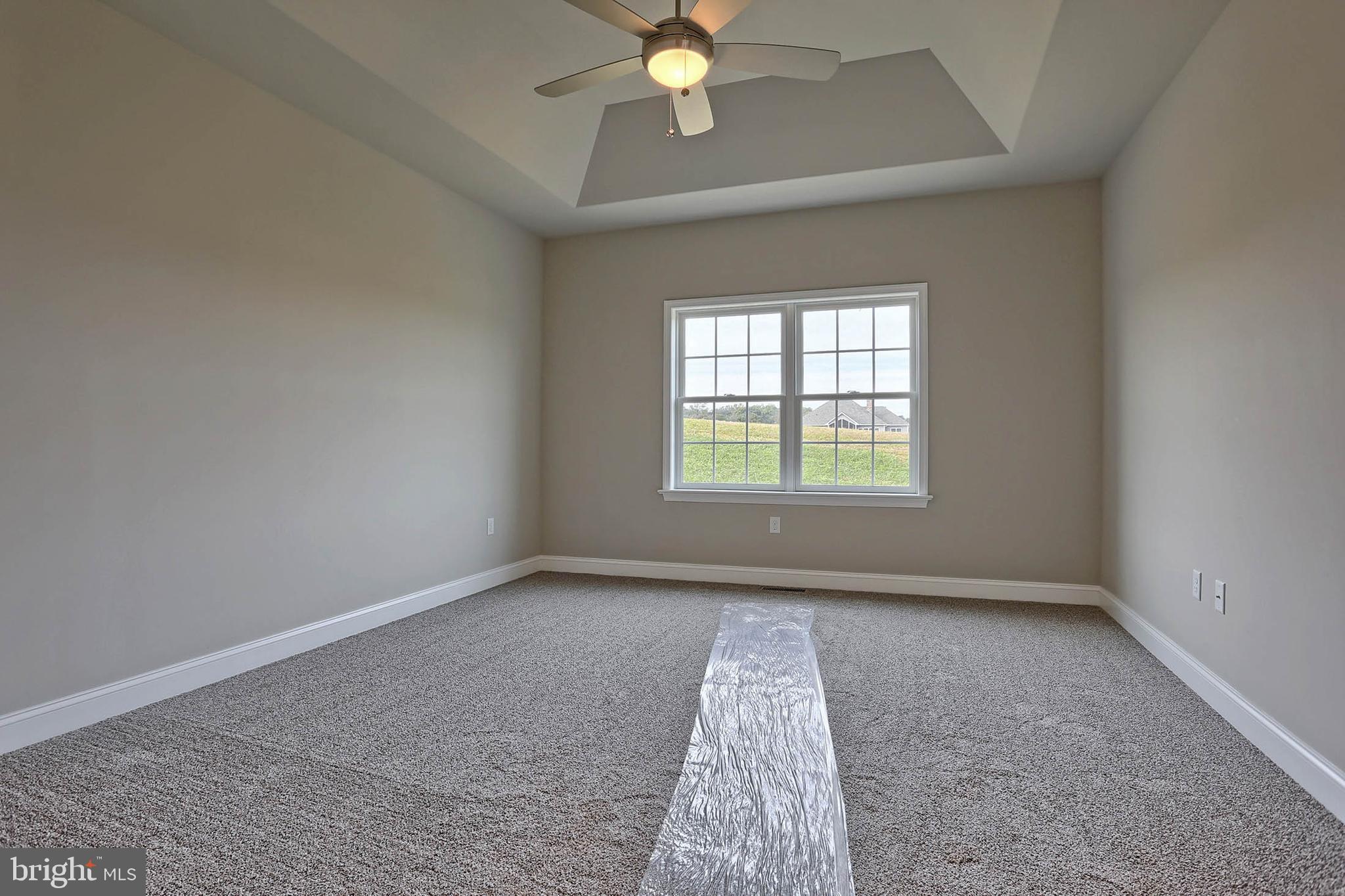 21 Rolling Meadow Road Lebanon, PA 17046 - Photo 24 of 37 an empty room with a chandelier fan and windows