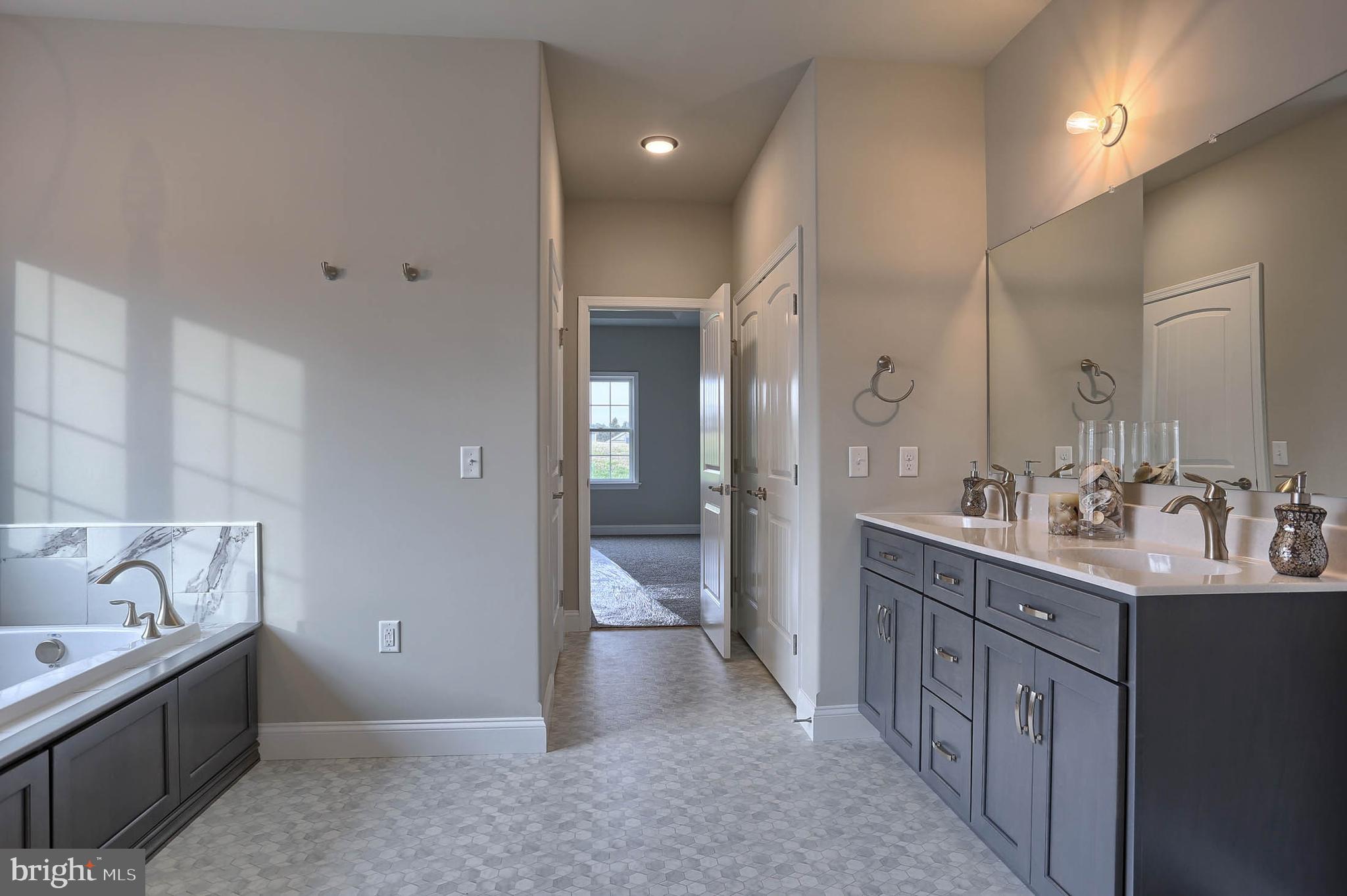 21 Rolling Meadow Road Lebanon, PA 17046 - Photo 26 of 37 a bathroom with a double vanity sink and a mirror