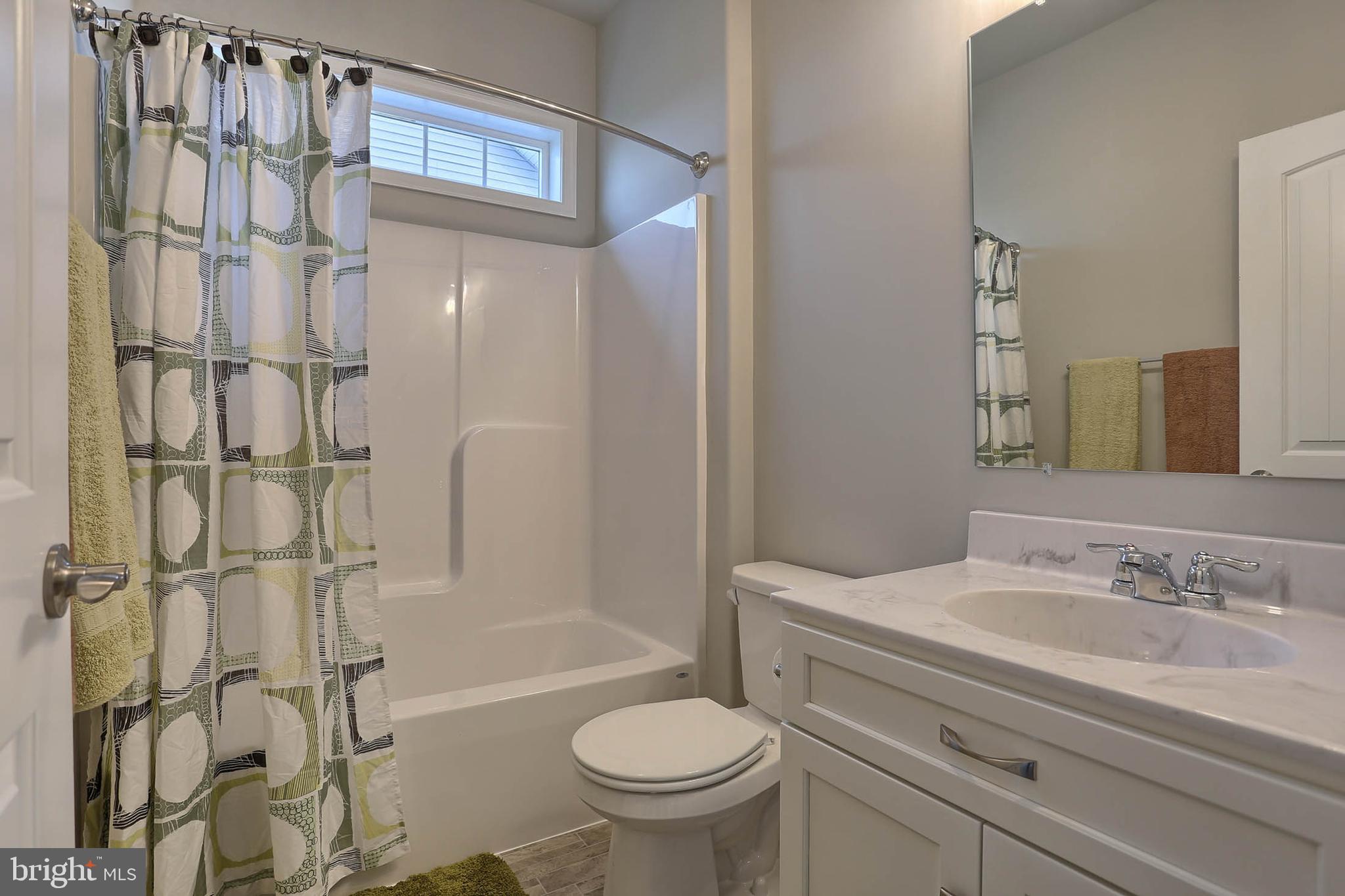 21 Rolling Meadow Road Lebanon, PA 17046 - Photo 31 of 37 a bathroom with a granite countertop sink toilet and shower
