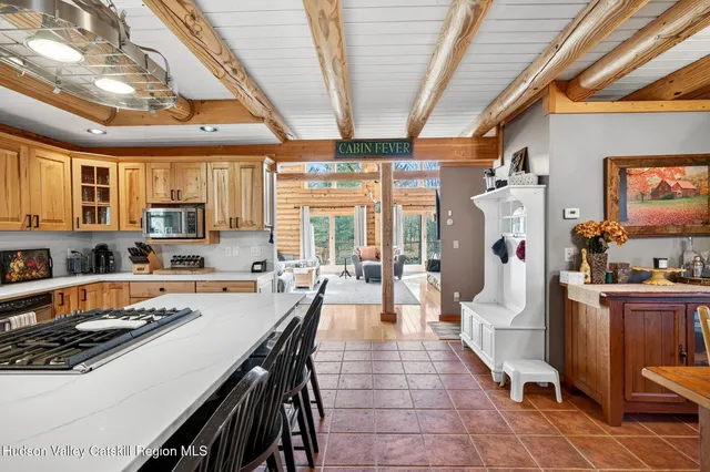 a view of a dining room with furniture and a chandelier