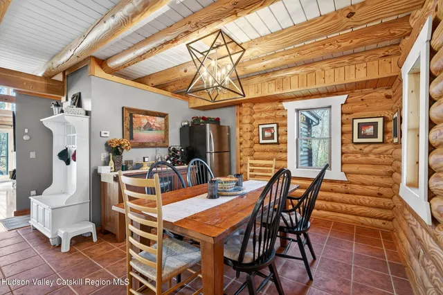 a spacious bedroom with a bed couch and a large window