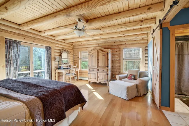 a bathroom with a toilet and shower