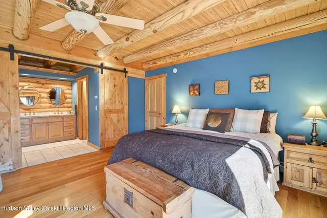 a bedroom with a bed and a lamp