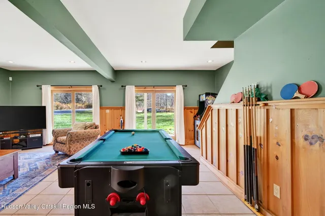 a view of a house with a yard and sitting area