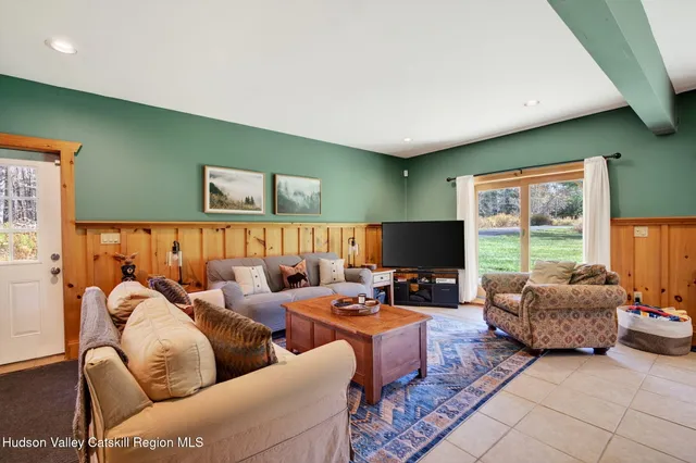 a view of a house with backyard and porch
