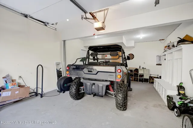 a front view of a house with a yard and a garage