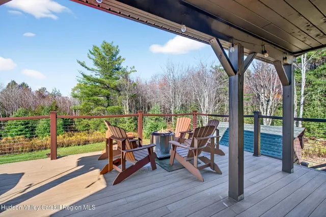 a view of a house with a yard and a garage