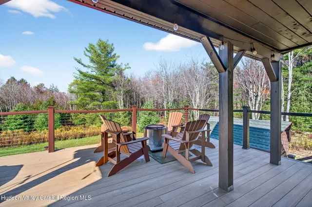 a view of a lush green hillside and a mountain