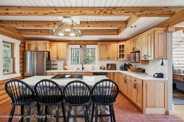 a kitchen with a appliances a sink and cabinets
