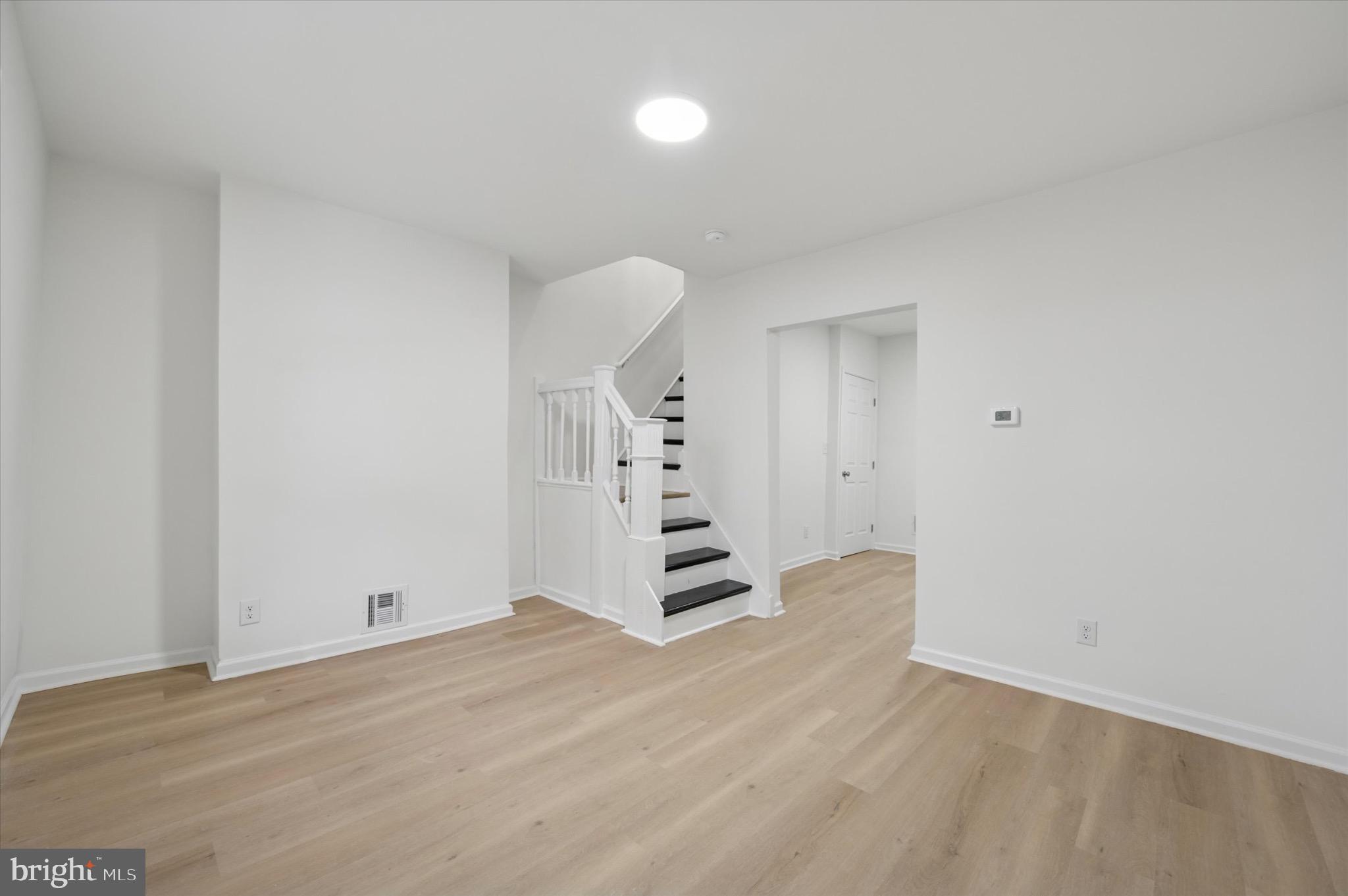 1452 North 56th Street Philadelphia, PA 19131 - Photo 2 of 12 a view of a room with wooden floor and window