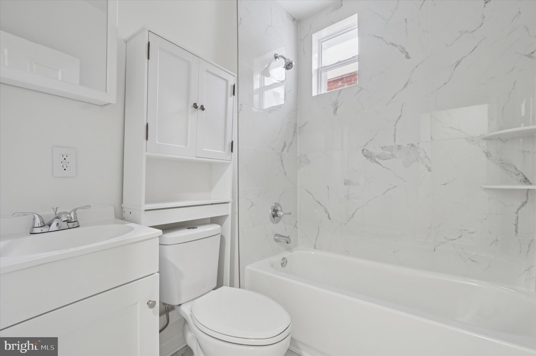 1452 North 56th Street Philadelphia, PA 19131 - Photo 7 of 12 a bathroom with a sink toilet and bathtub