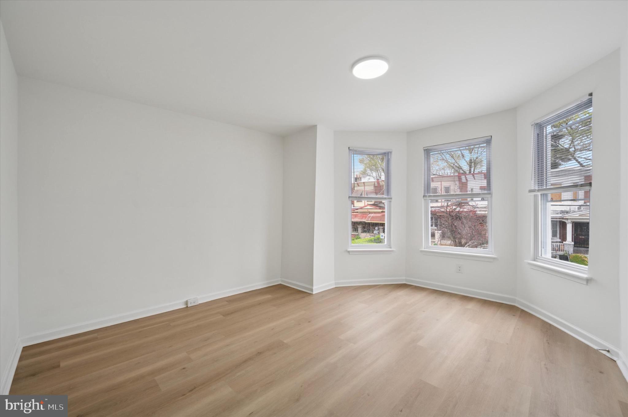 1452 North 56th Street Philadelphia, PA 19131 - Photo 9 of 12 wooden floor in an empty room with a window