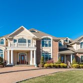 a front view of a house with a porch