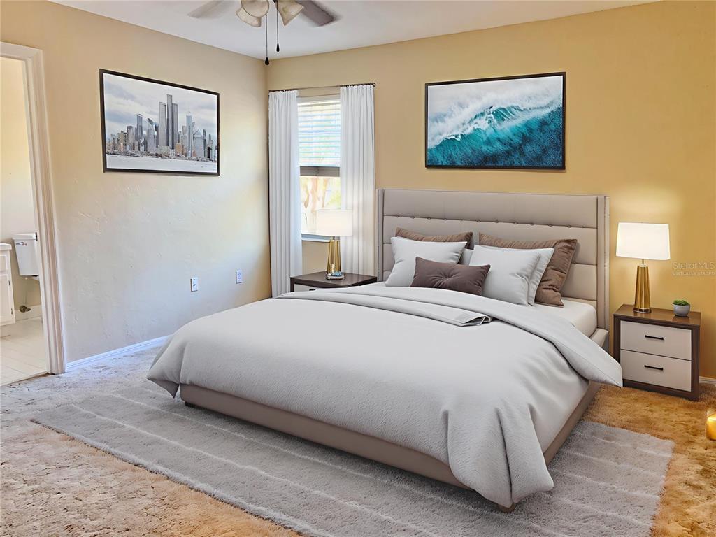 5268 Southwest 97 Way Gainesville, FL 32608 - Photo 11 of 33 a bedroom with a bed and a painting on the wall