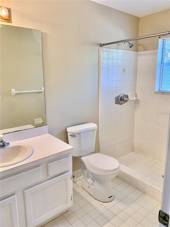 5268 Southwest 97 Way Gainesville, FL 32608 - Photo 15 of 33 a bathroom with a sink a toilet and shower