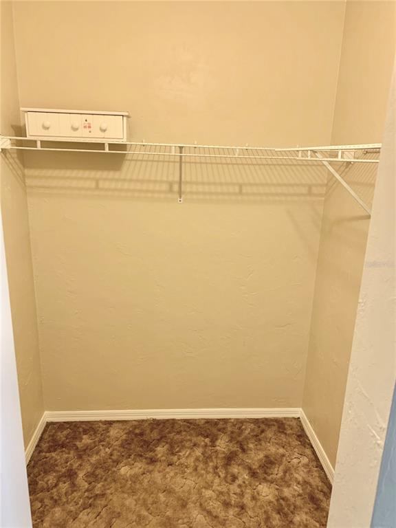 5268 Southwest 97 Way Gainesville, FL 32608 - Photo 16 of 33 a view of water heater room with wooden floor