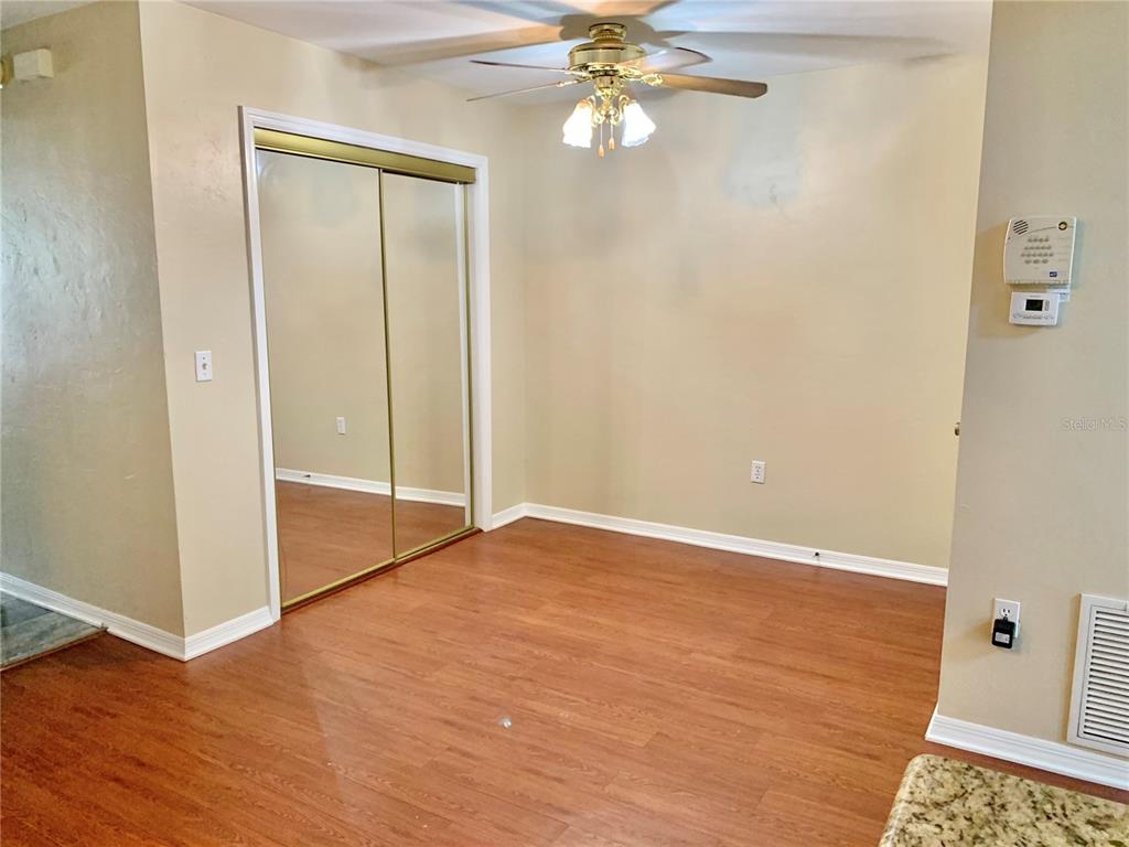 5268 Southwest 97 Way Gainesville, FL 32608 - Photo 20 of 33 a view of an empty room with wooden floor