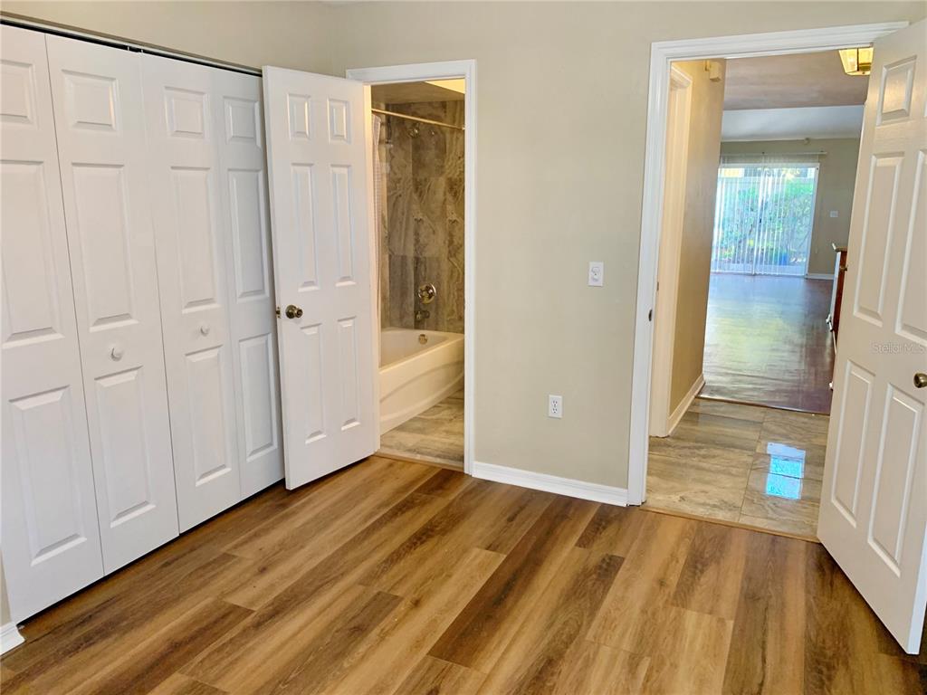 5268 Southwest 97 Way Gainesville, FL 32608 - Photo 25 of 33 a view of a room with wooden floor