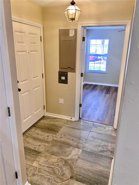 5268 Southwest 97 Way Gainesville, FL 32608 - Photo 27 of 33 an empty room with wooden floor and windows