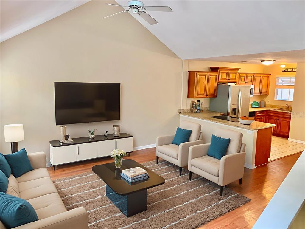 5268 Southwest 97 Way Gainesville, FL 32608 - Photo 8 of 33 a living room with furniture and a flat screen tv