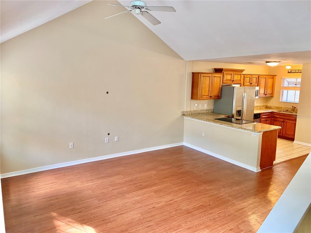 5268 Southwest 97 Way Gainesville, FL 32608 - Photo 9 of 33 a view of a kitchen with wooden floor and a sink