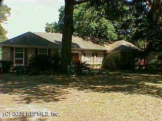 8663 Sanchez Road Jacksonville, FL 32217 - Photo 1 of 1 a front view of a house with a garden