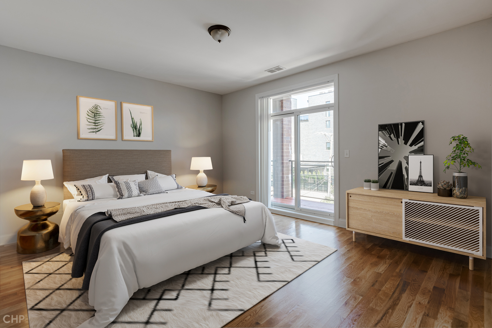 17 North Bishop Street, Unit 3 Chicago, IL 60607 - Photo 6 of 9 a spacious bedroom with a bed and a large window