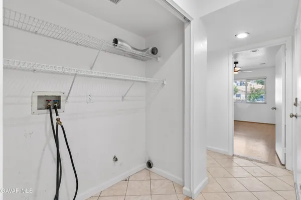 a bathroom with a sink a toilet a mirror and shower curtain