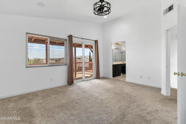 a view of an empty room with a fireplace
