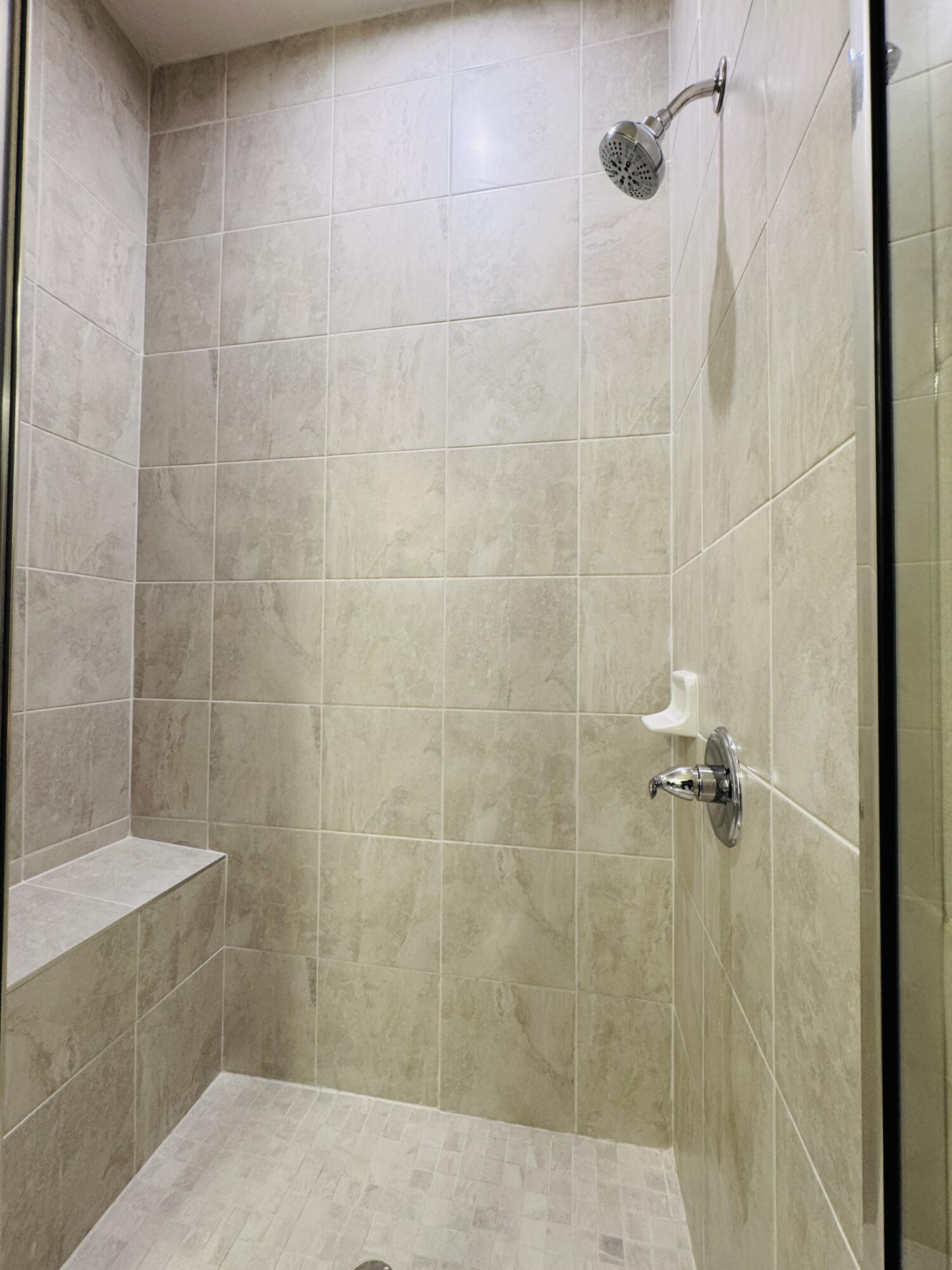 163 Southwest Pomeroy Street Stuart, FL 34997 - Photo 21 of 52 a bathroom with a shower