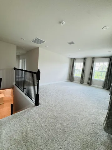 an empty room that has a bathroom