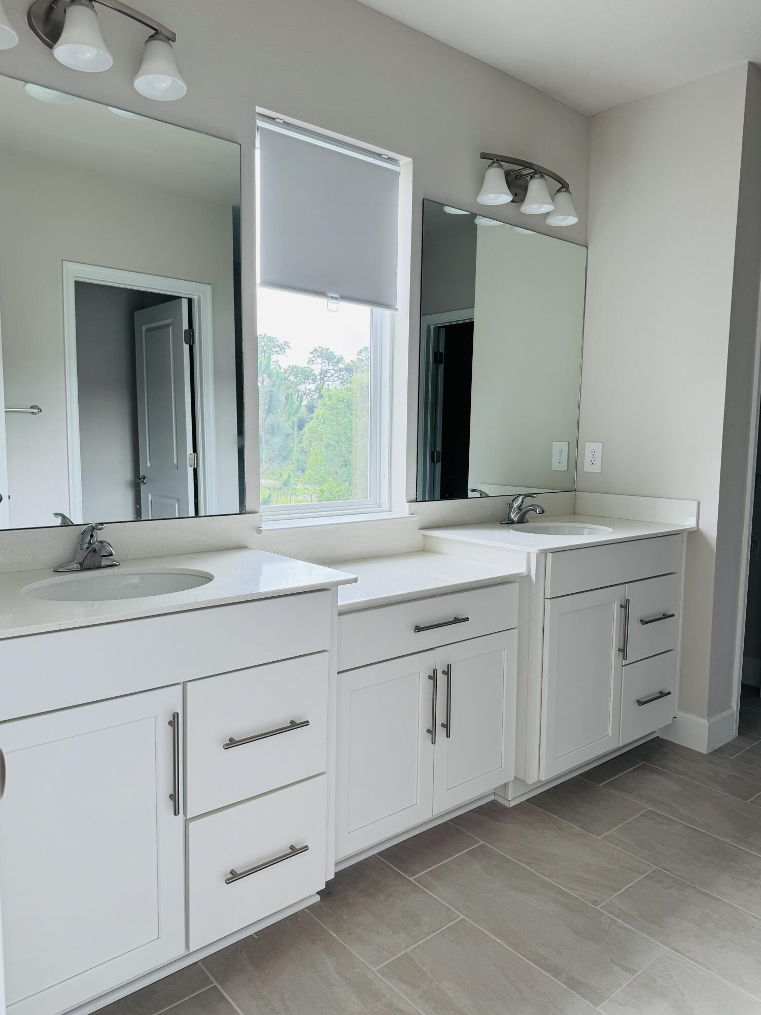 163 Southwest Pomeroy Street Stuart, FL 34997 - Photo 35 of 52 a bathroom with a sink and a mirror