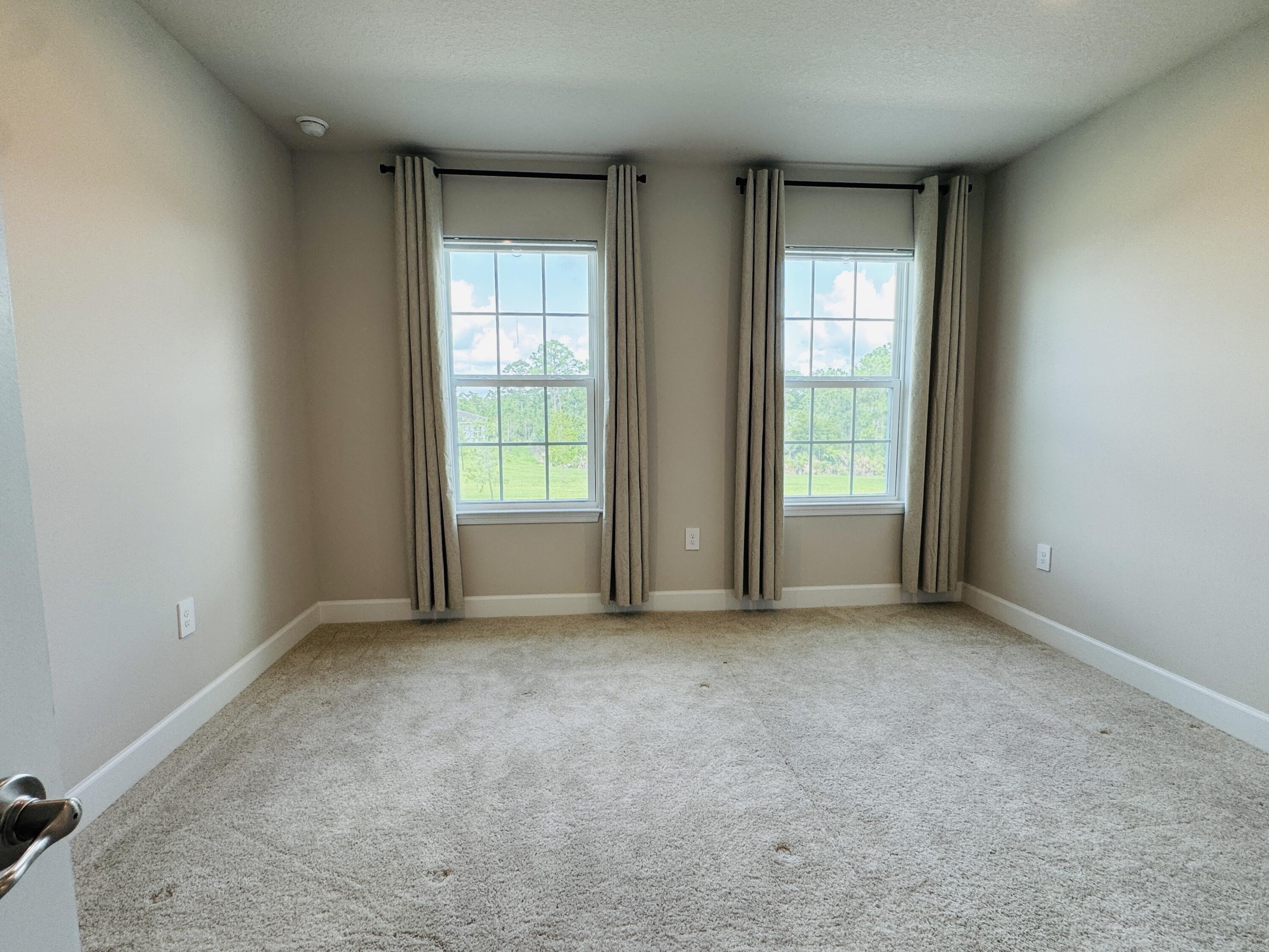 163 Southwest Pomeroy Street Stuart, FL 34997 - Photo 40 of 52 an empty room with windows