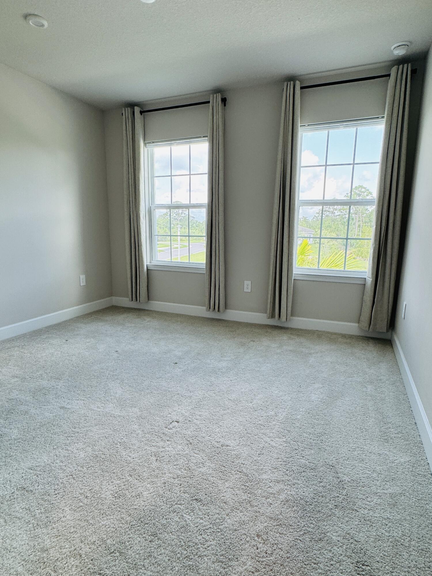 163 Southwest Pomeroy Street Stuart, FL 34997 - Photo 41 of 52 an empty room with windows