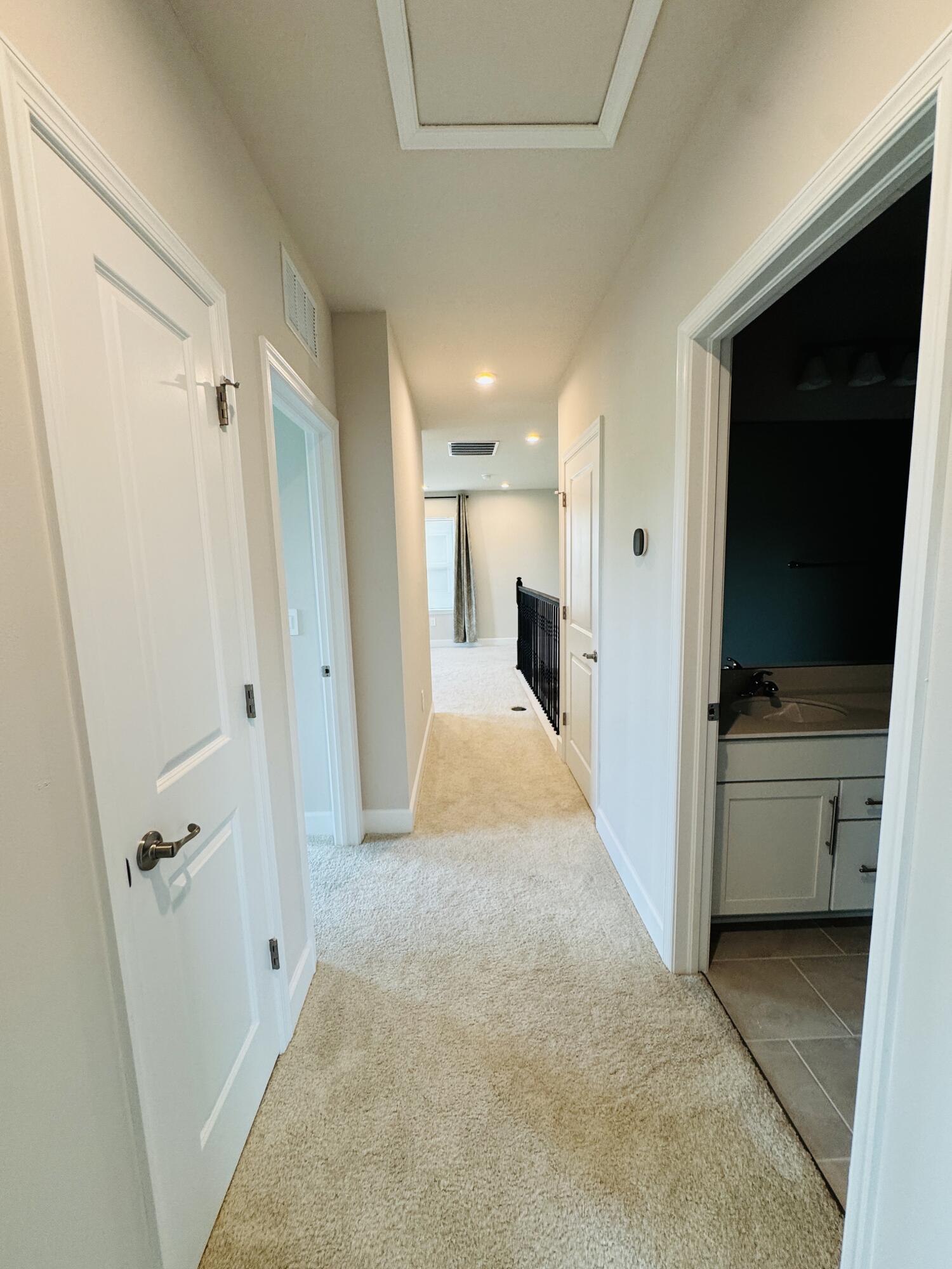 163 Southwest Pomeroy Street Stuart, FL 34997 - Photo 47 of 52 a view of a hallway to a kitchen