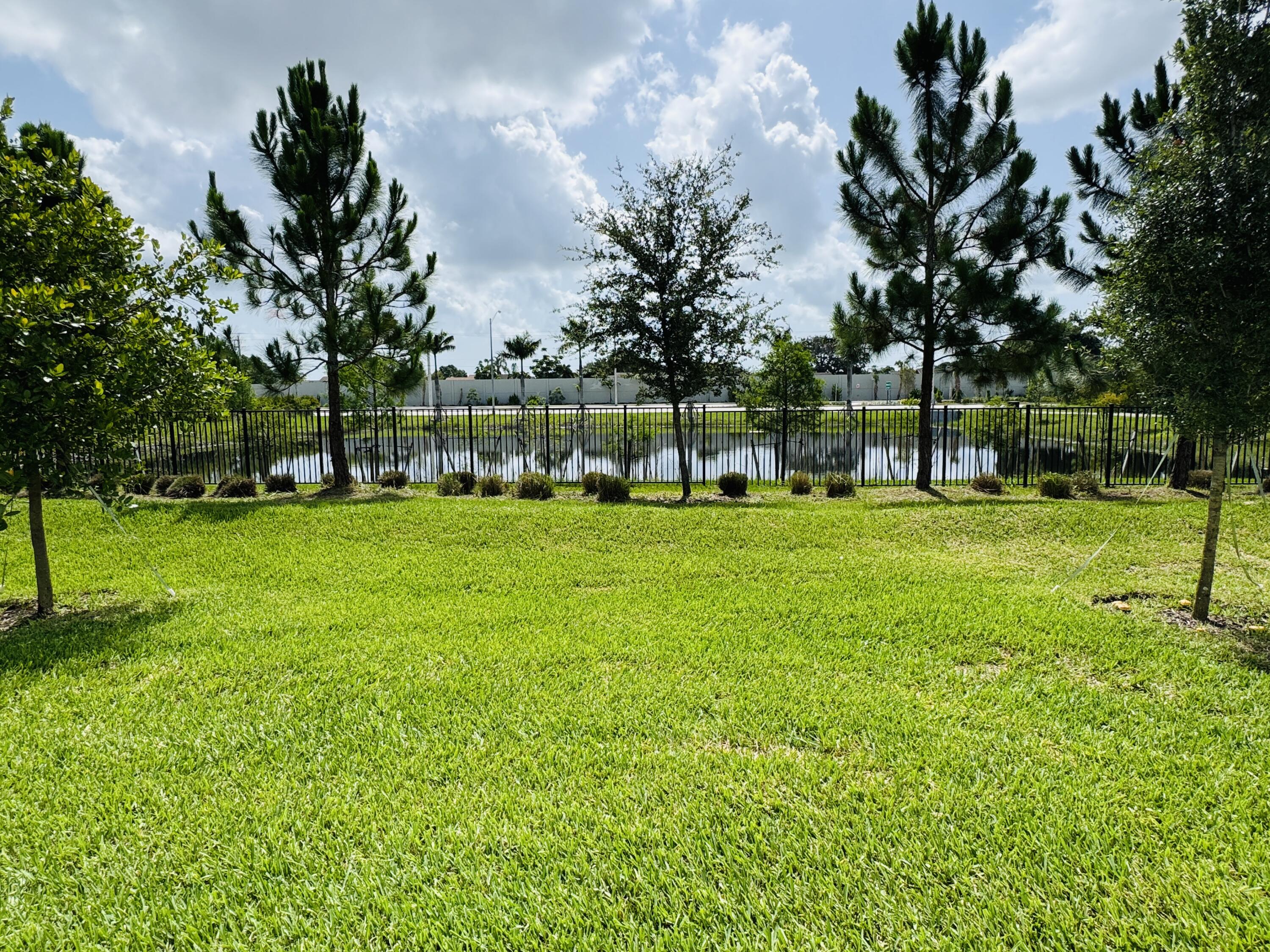 163 Southwest Pomeroy Street Stuart, FL 34997 - Photo 52 of 52 a view of a park with large trees