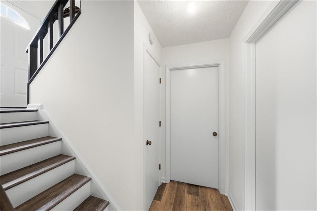 2561 Ripple Way Lawrenceville, GA 30043 - Photo 16 of 19 a view of a hallway with wooden floor and entryway