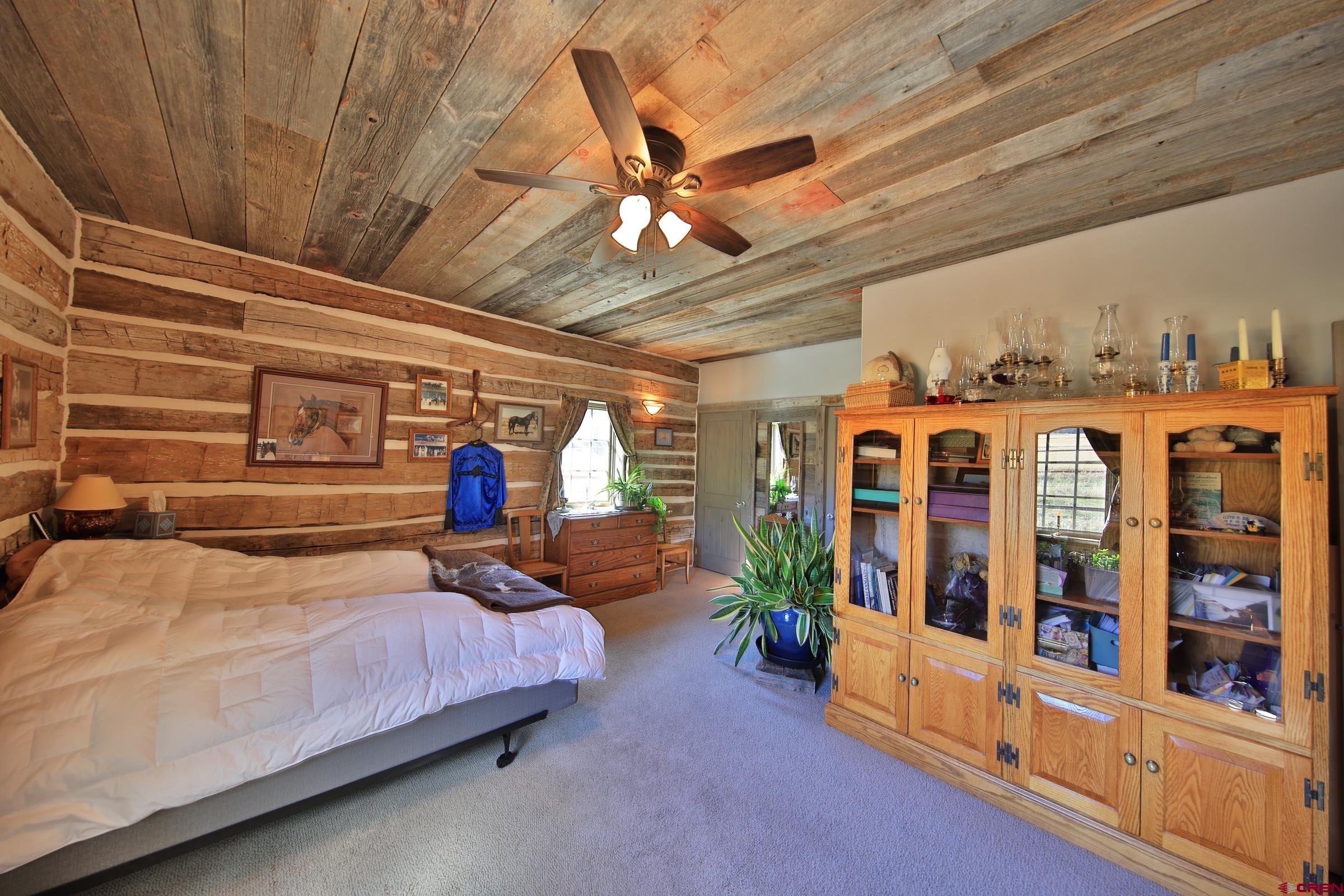 10497 54 7/10 Road Molina, CO 81646 - Photo 19 of 45 a bedroom with furniture and window