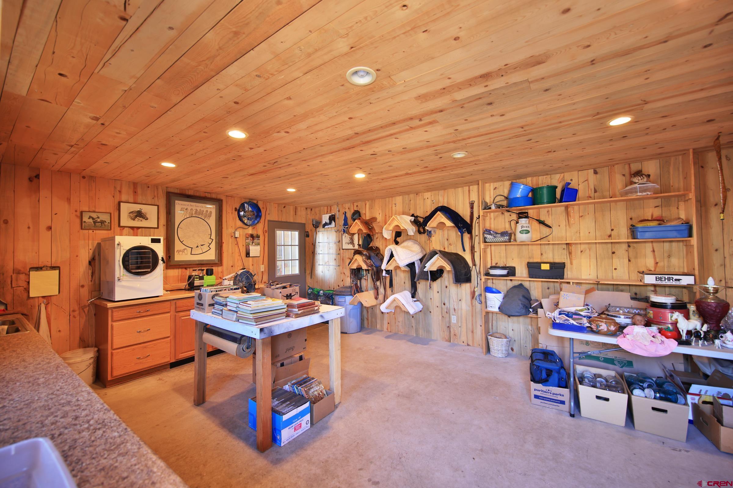 10497 54 7/10 Road Molina, CO 81646 - Photo 30 of 45 a living room with lots of furniture and air hockey table
