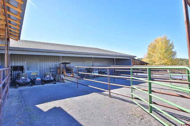 a living room with couch and a wooden floor