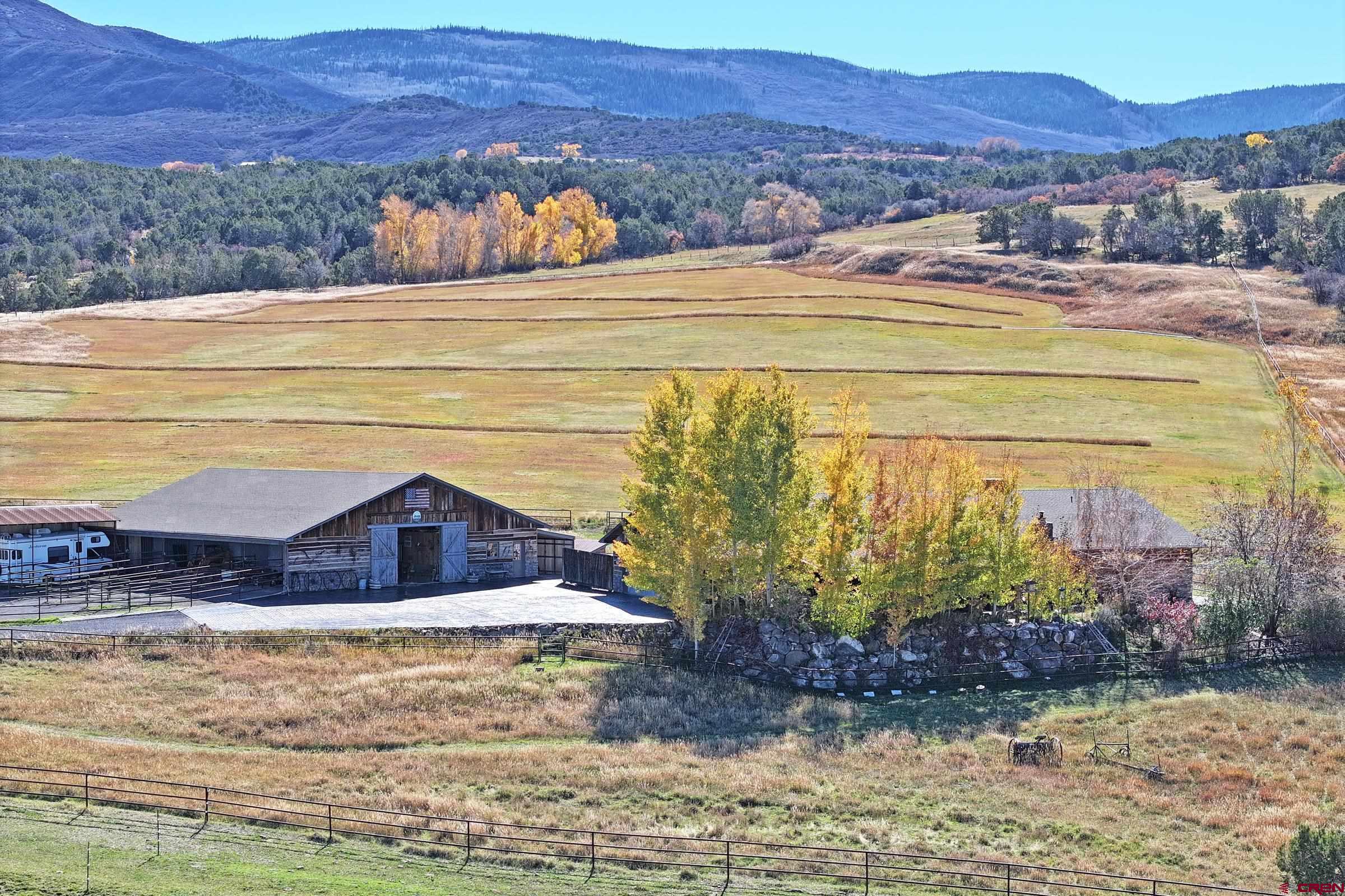 10497 54 7/10 Road Molina, CO 81646 - Photo 33 of 45 a view of a house with a yard