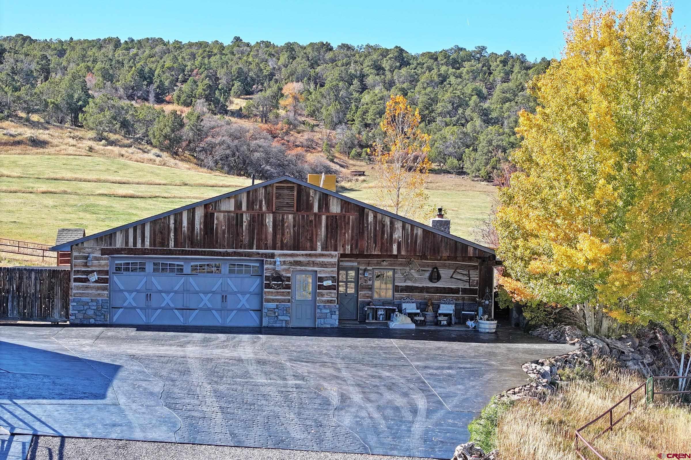 10497 54 7/10 Road Molina, CO 81646 - Photo 5 of 45 a view of a house with a yard